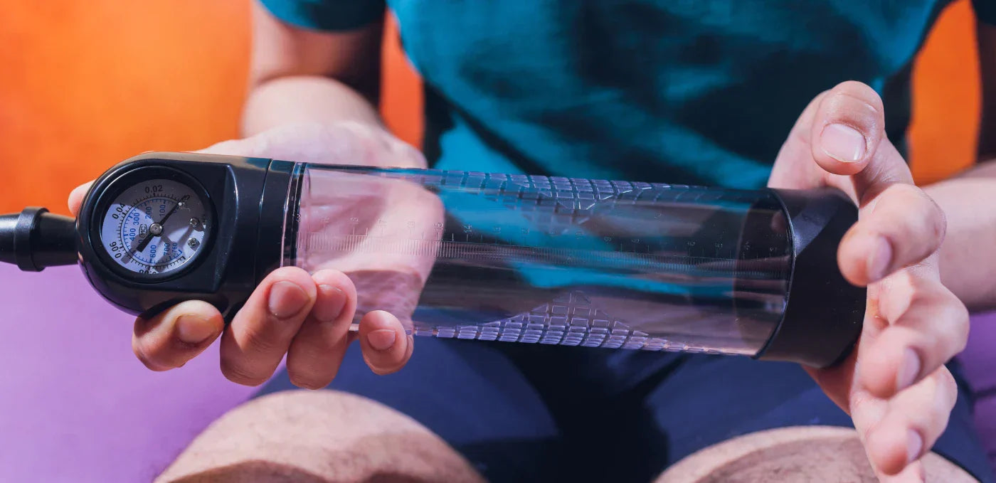 Man holding a penis pump