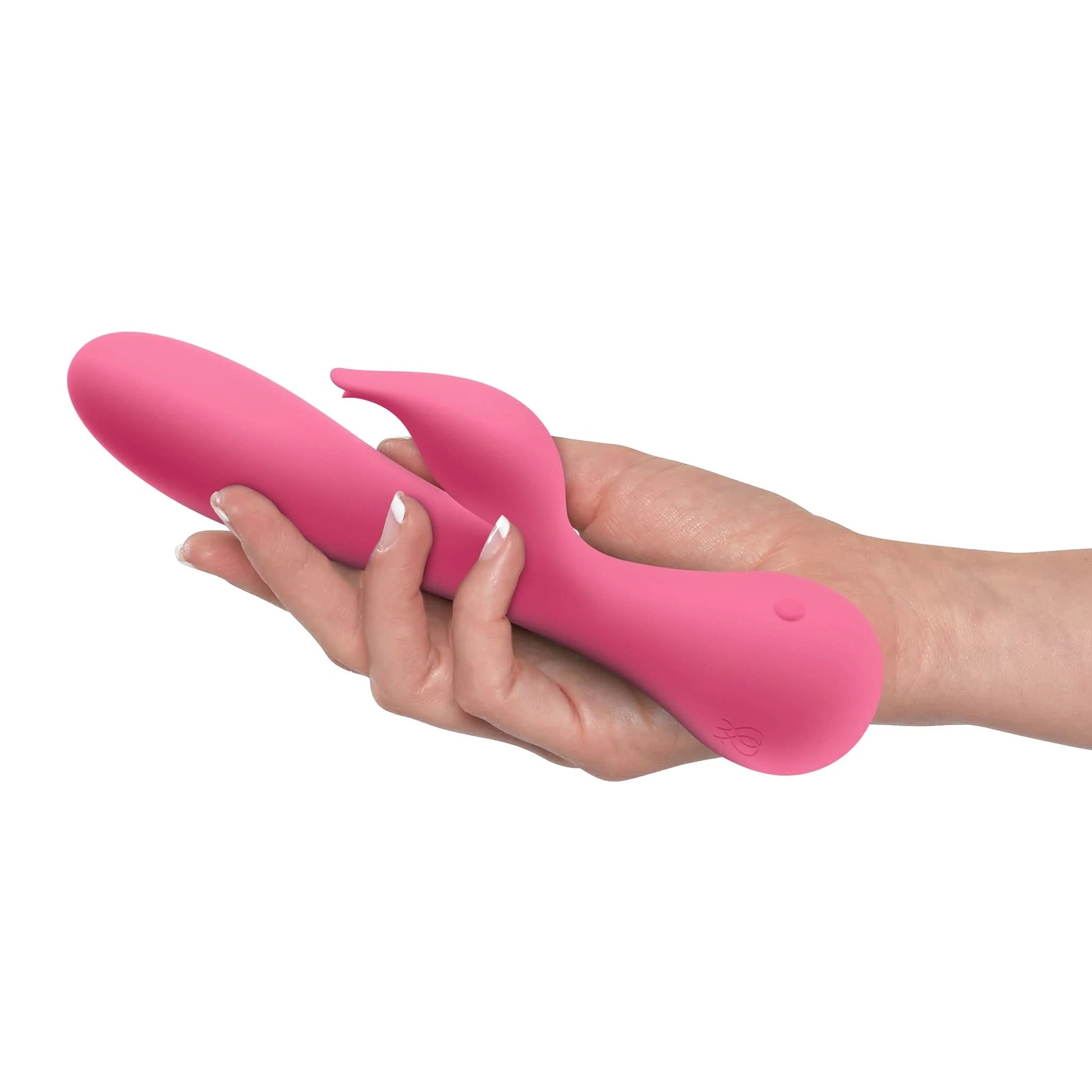 A hand holds the JIMMYJANE® Glo Rabbit, a pink vibrator designed for clitoral and g-spot stimulation, against a white background.