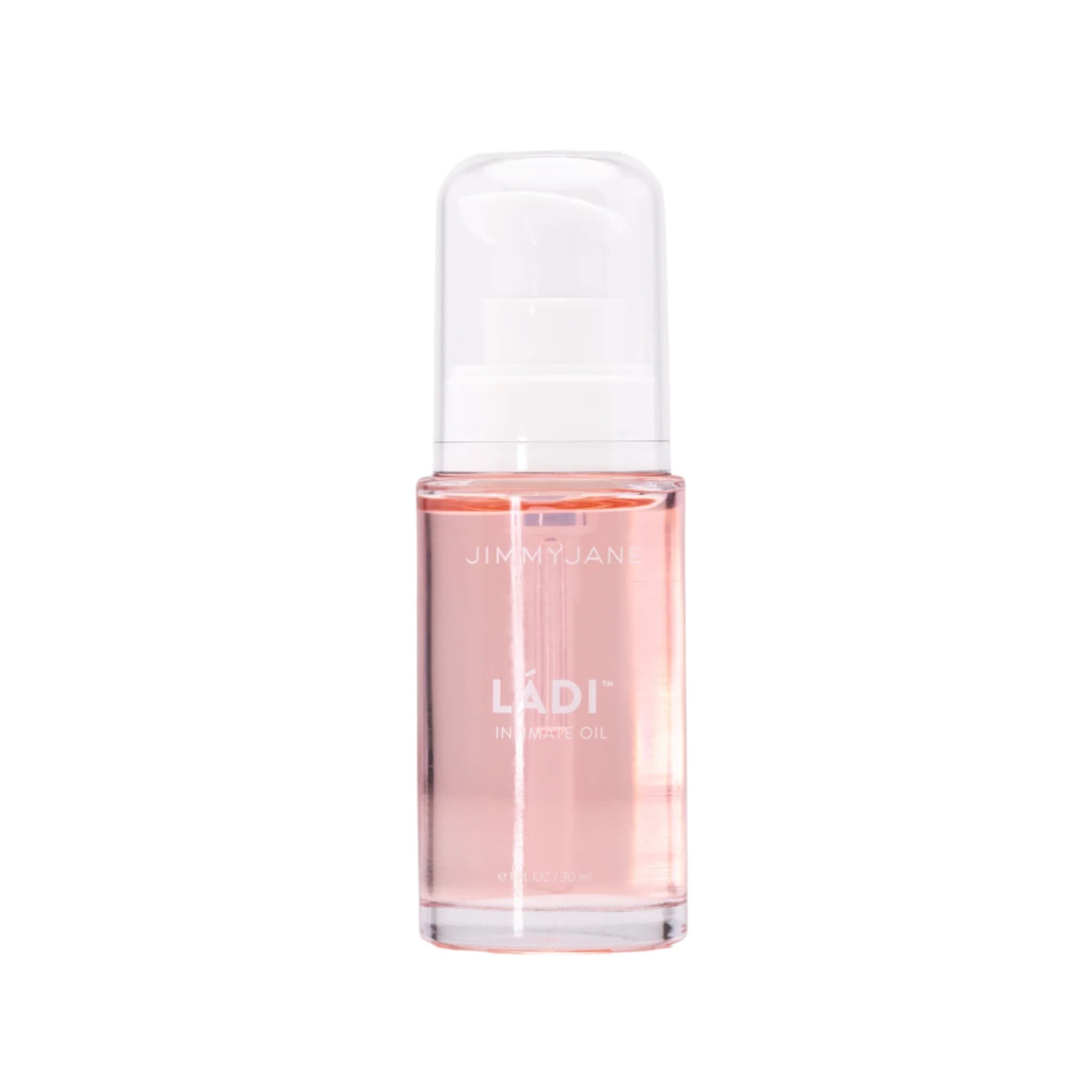 Clear bottle of pink Ládi™ Oil by JIMMYJANE® with a white pump dispenser and branded label, designed to relieve vaginal dryness and hydrate skin.