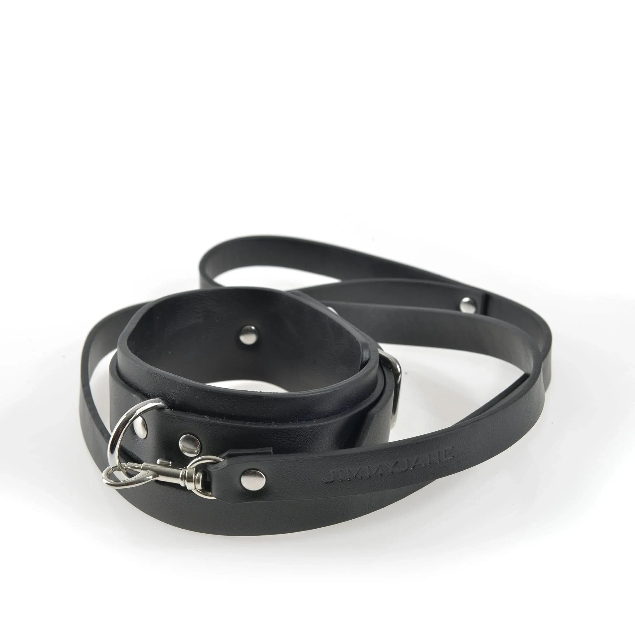 The JIMMYJANE® 7-Piece Bondage Set includes a sleek black vegan leather leash with metal clasp, ideal for enhancing couples experiences or as the perfect addition to your bondage kit.