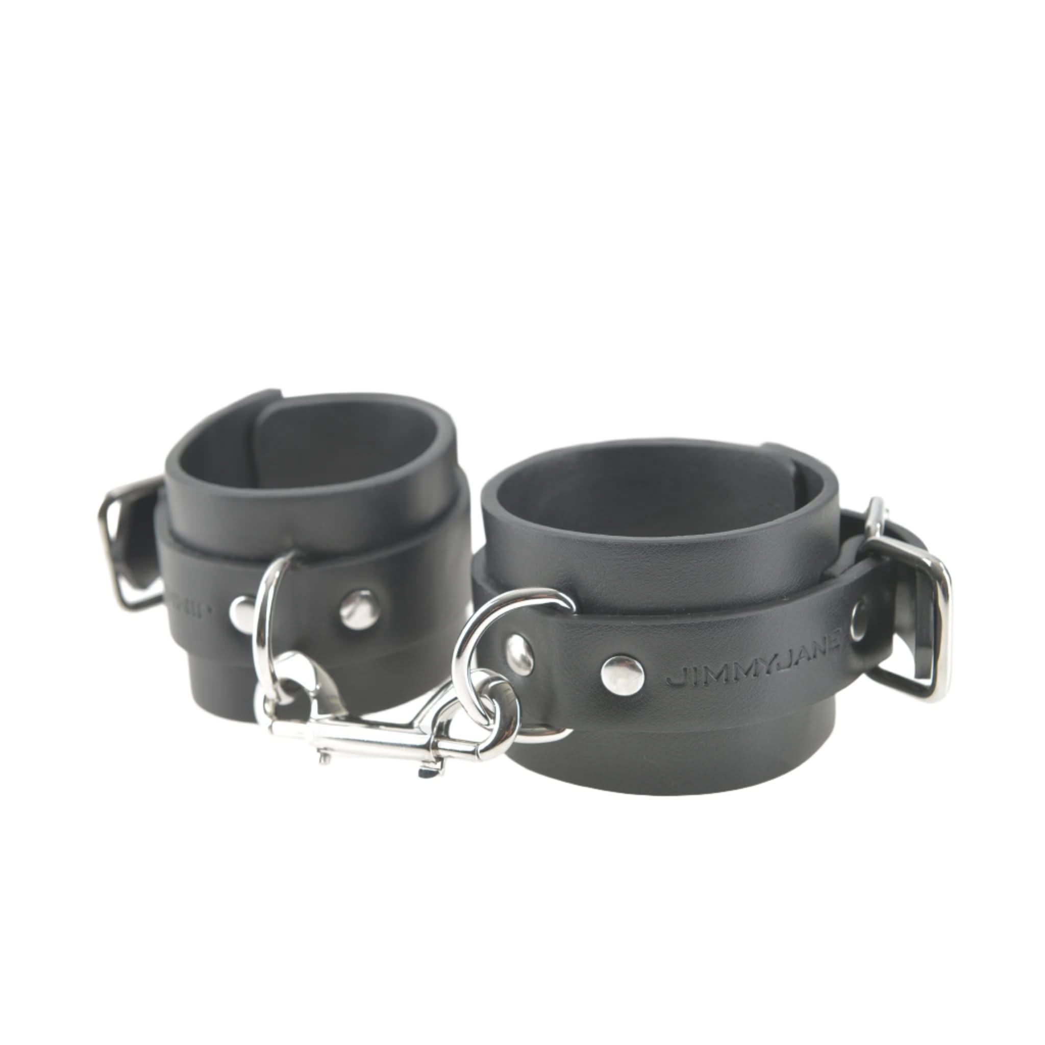 JIMMYJANE® Bondage Cuffs are made from durable vegan leather, featuring metal buckles, D-rings, and a sturdy metal clip—ideal for couples play.