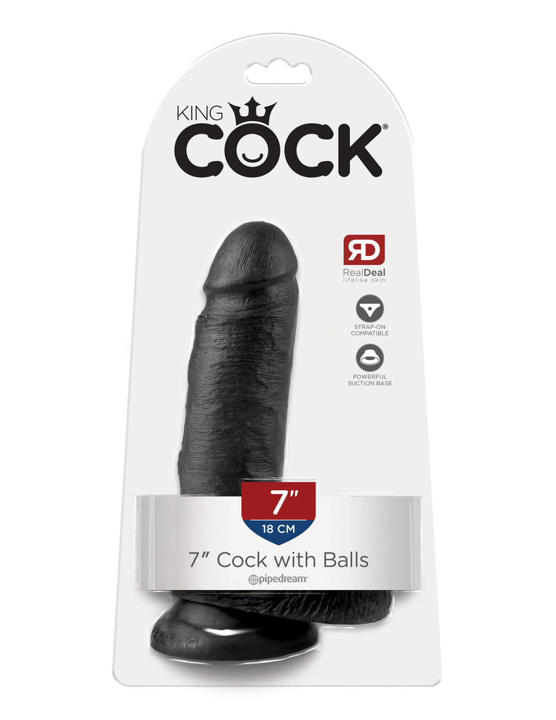 This is an image of The King Cock¬ 7" Cock with Balls - Black. . Do you want your first dildo to look and feel just like the rock-hard stud you've always fantasized about? Stop dreaming and get down with the King! Every vein, every shaft, and every head is carefully handcrafted with exquisite detail to give you the most realistic experience ever imagined.