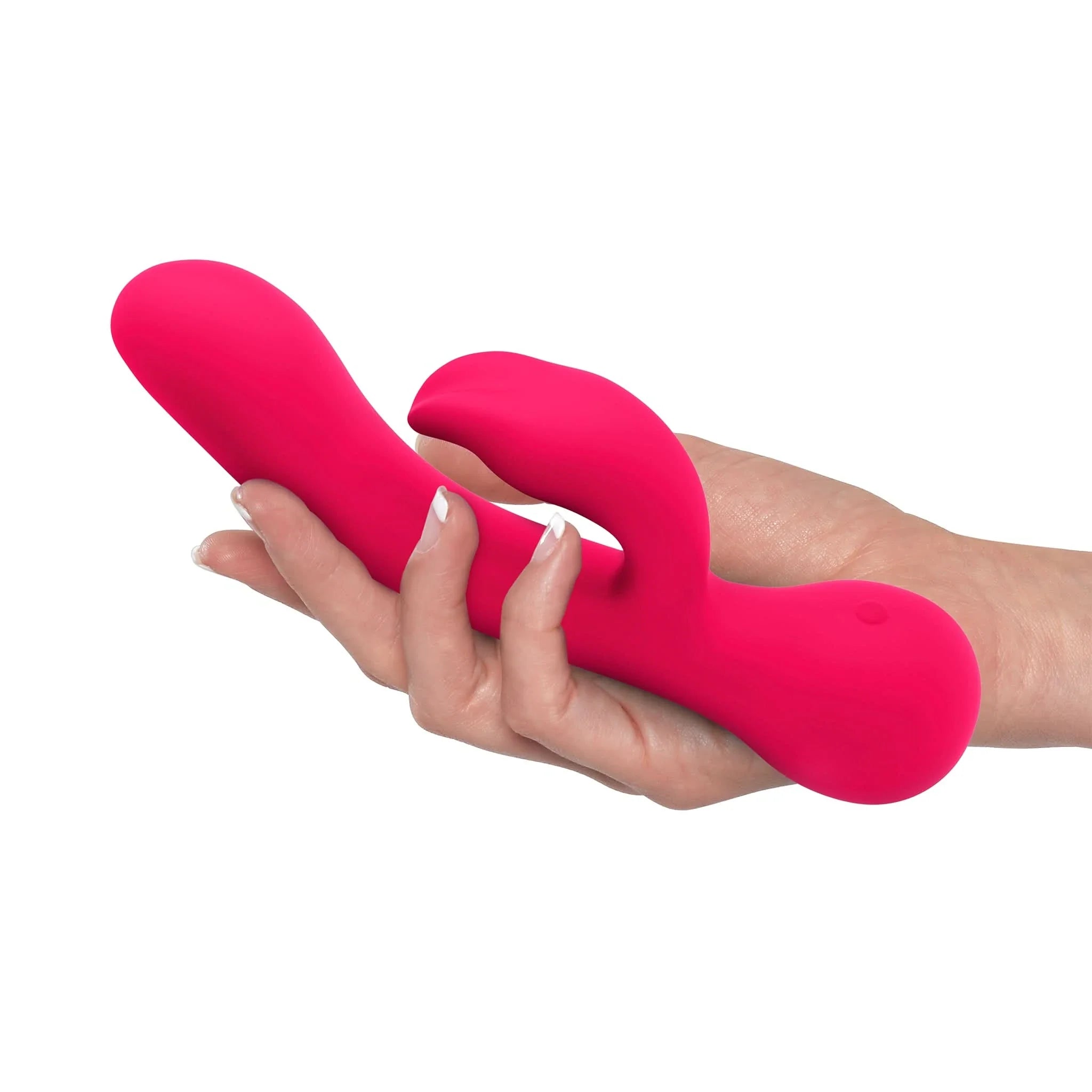 A hand holds the JIMMYJANE® Ruby Rabbit, a bright pink silicone vibrator designed for G-Spot and clitoral stimulation, against a white background.