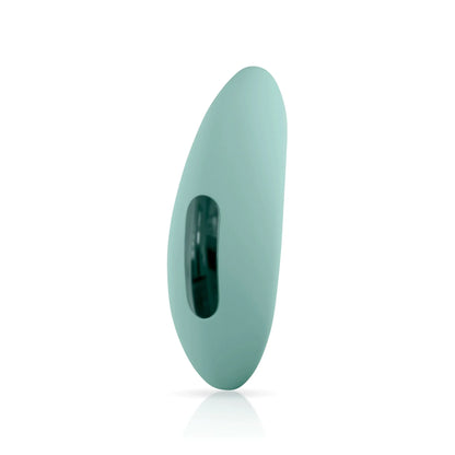 The ASCEND 3® by JIMMYJANE® is a light green, oval-shaped silicone stimulator with a black slot and flexible design for clitoral stimulation, shown standing upright on a white background.