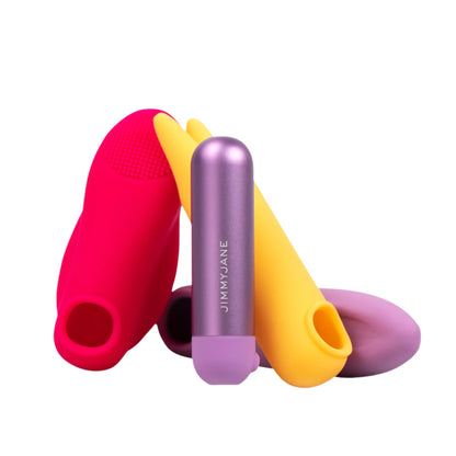 Three colorful silicone vibrators and the JIMMYJANE® Chroma™ Mini with Remote, a purple aluminum bullet vibrator, are arranged upright on a white background.