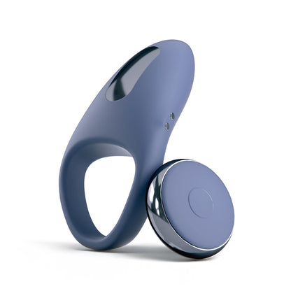 The JIMMYJANE® Tarvos™ with Remote is a blue vibrating silicone c-ring with metallic accents and a round remote, designed for clitoral stimulation, shown on a white background.