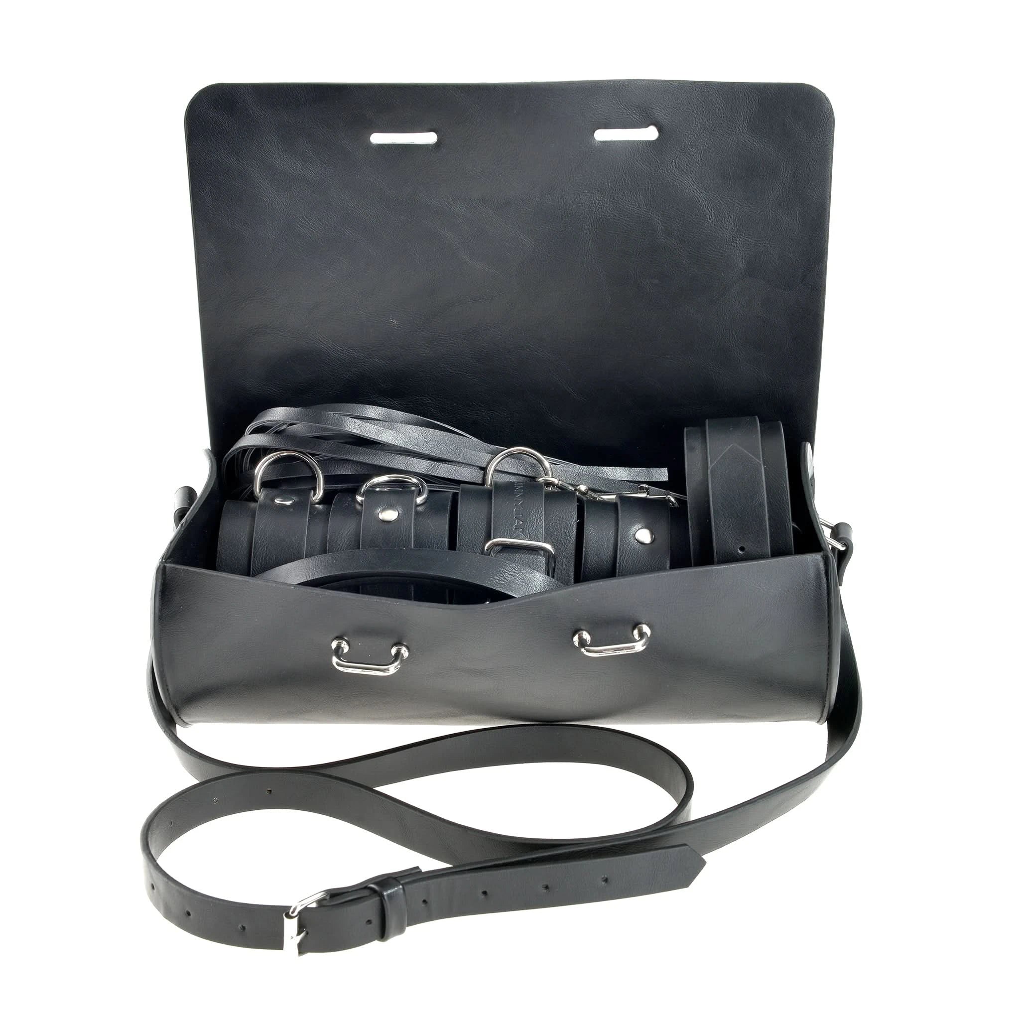 The JIMMYJANE® 7-Piece Bondage Set bag opens to reveal multiple black vegan leather straps, belts, and shiny metal buckles—ideal for adventurous couples seeking new experiences.