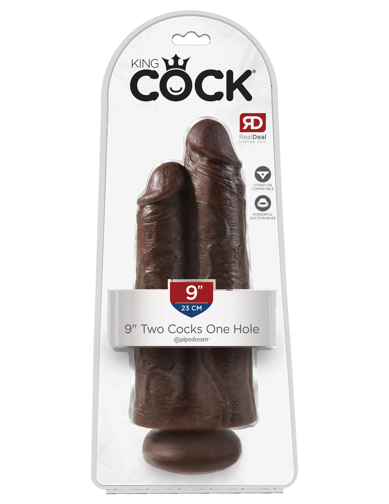 This is an image of The King Cock 9" Two Cocks One Hole - Brown. . This King CocK satisfies your 2-in-1 fantasies with one thick dildo sculpted from two lifelike cocks. <br>Exquisitely handcrafted and flexible, the King Cock¬ Two Cocks One Hole provides exciting stimulation and a satisfying feeling of fullness. The powerful suction cup base sticks to nearly any flat surface and makes every dildo harness compatible.
